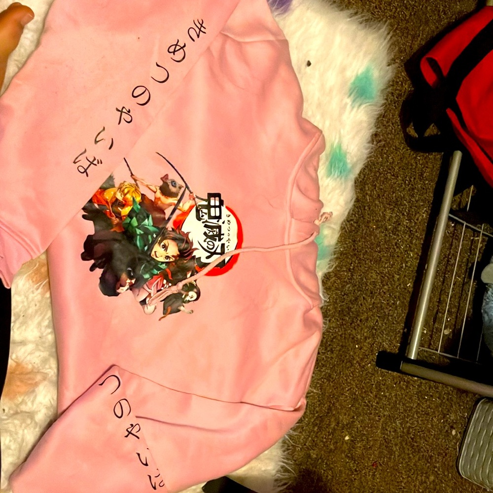 I am selling a Pink sweatshirt,it’s a anime sweatshirt,with demon slayer